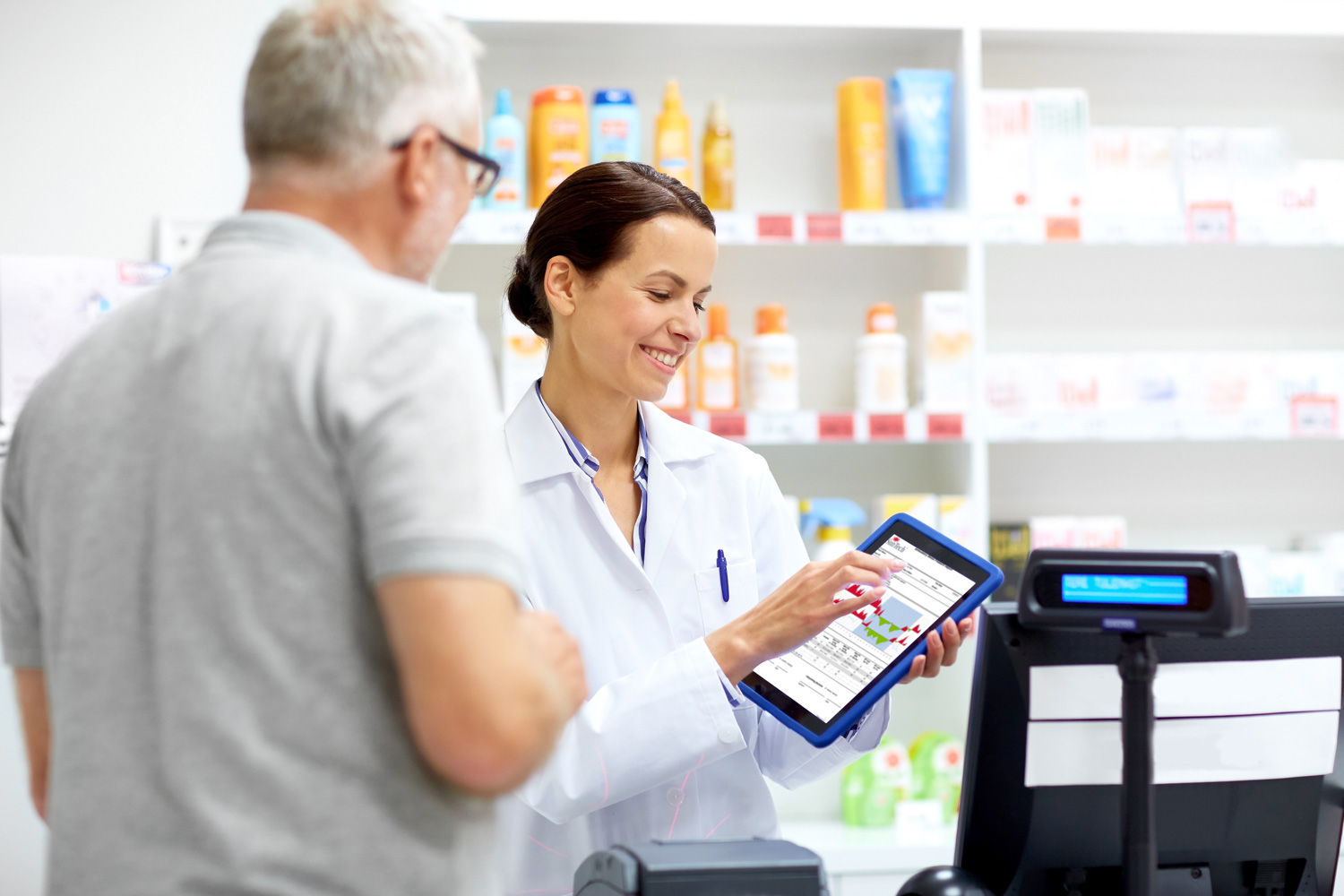 Doctor showing a patient an ABPM report